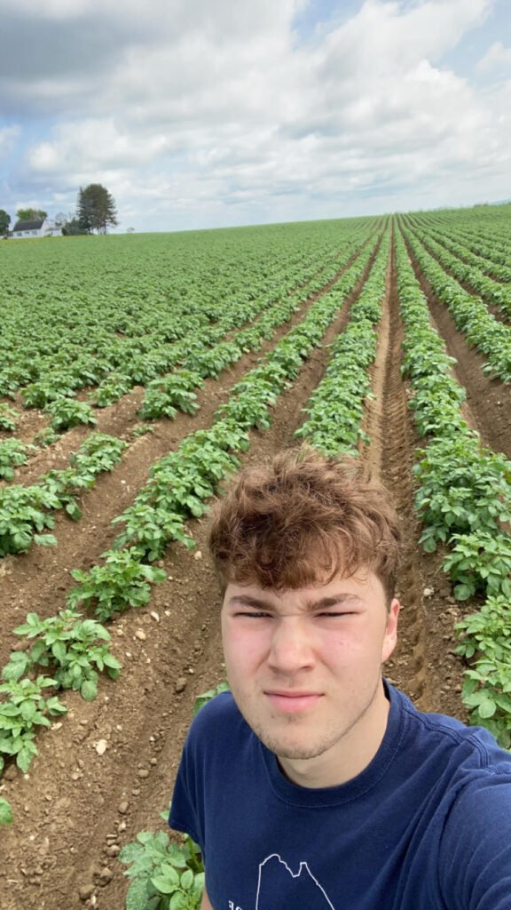 Me standing in a potato field